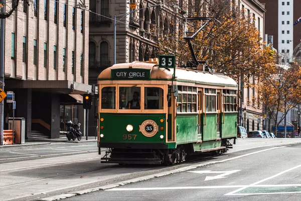 Heritage City Circle tram on a Melbourne street in autumn