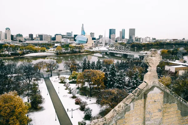 Winnipeg skyline and the Red River after an early snowfall