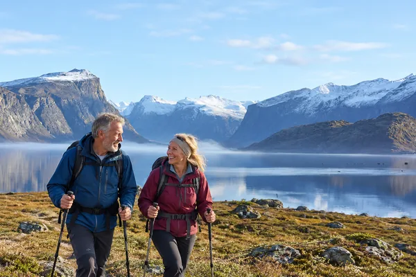 Couple hiking beside Pangnirtung Fjord, Nunavut