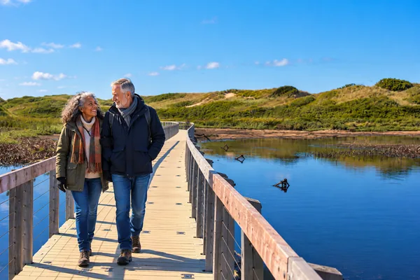 Couple on the floating boardwalk at Greenwich, Prince Edward Island National Park